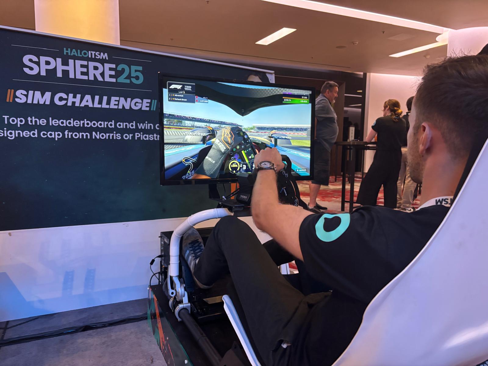 A person driving an F1 racing simulator.